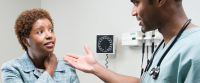 Nurse talking to patient.